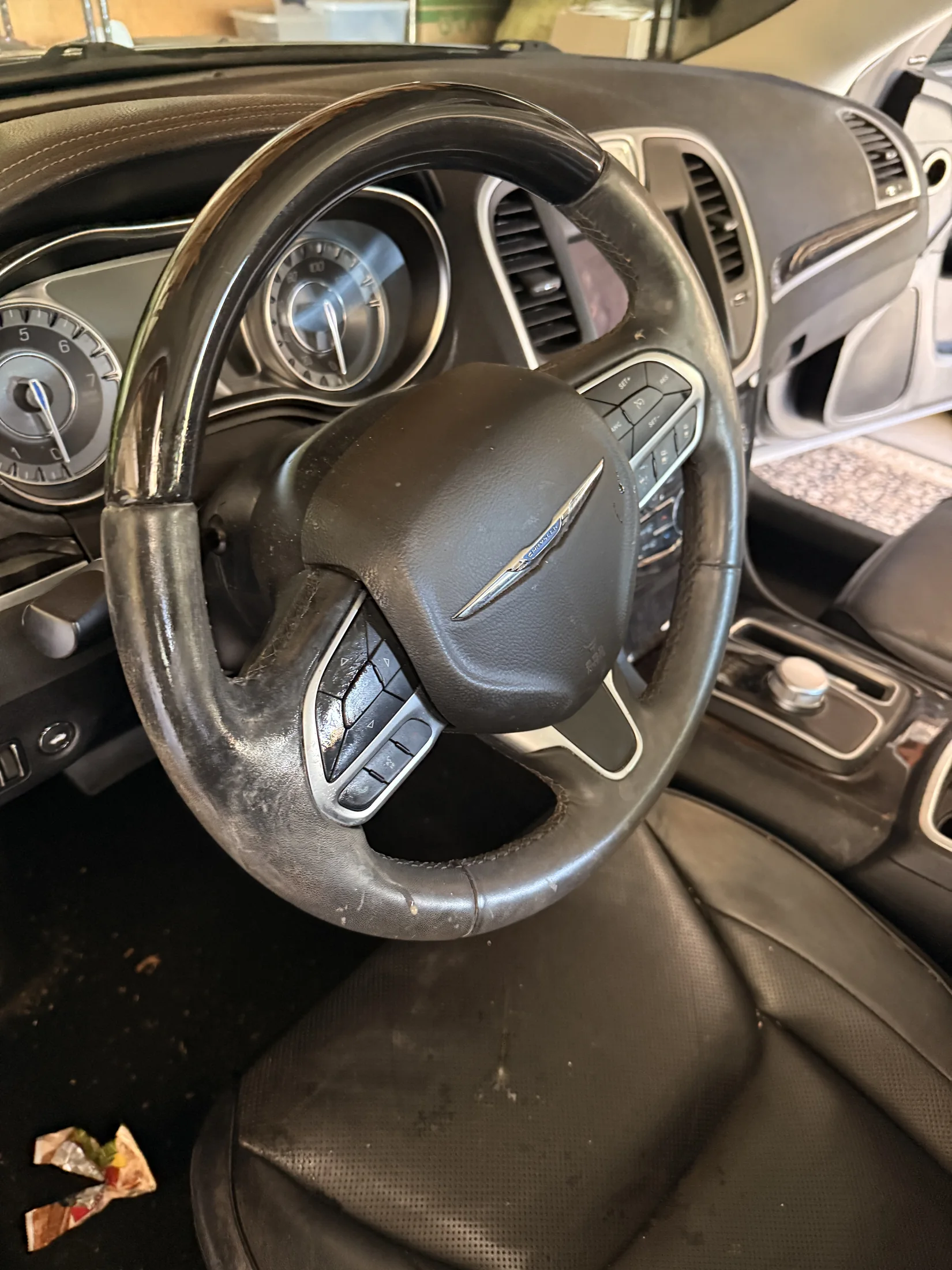 Chrysler steering wheel and console before interior detailing