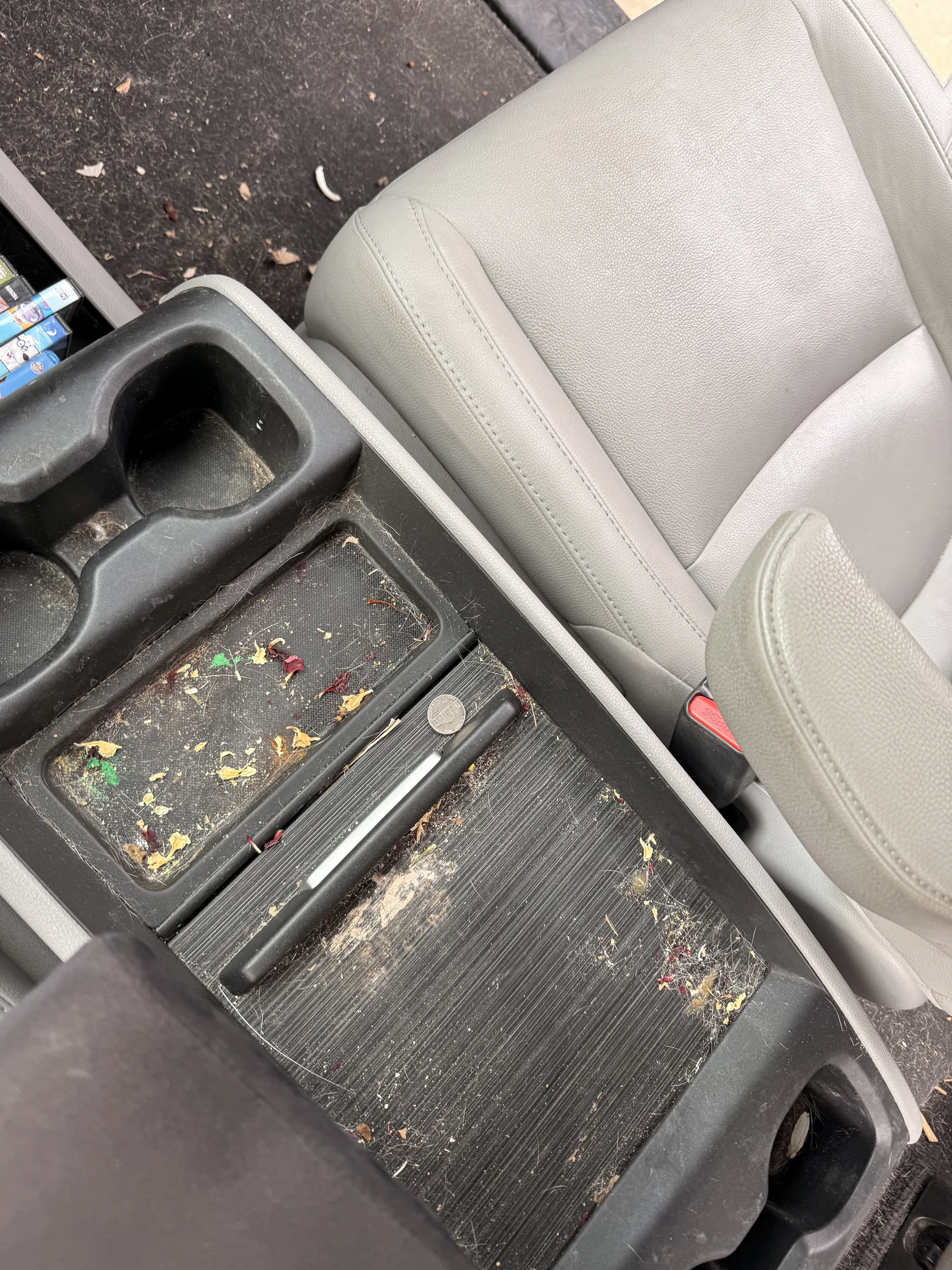 Cupholder with food debris before interior detailing