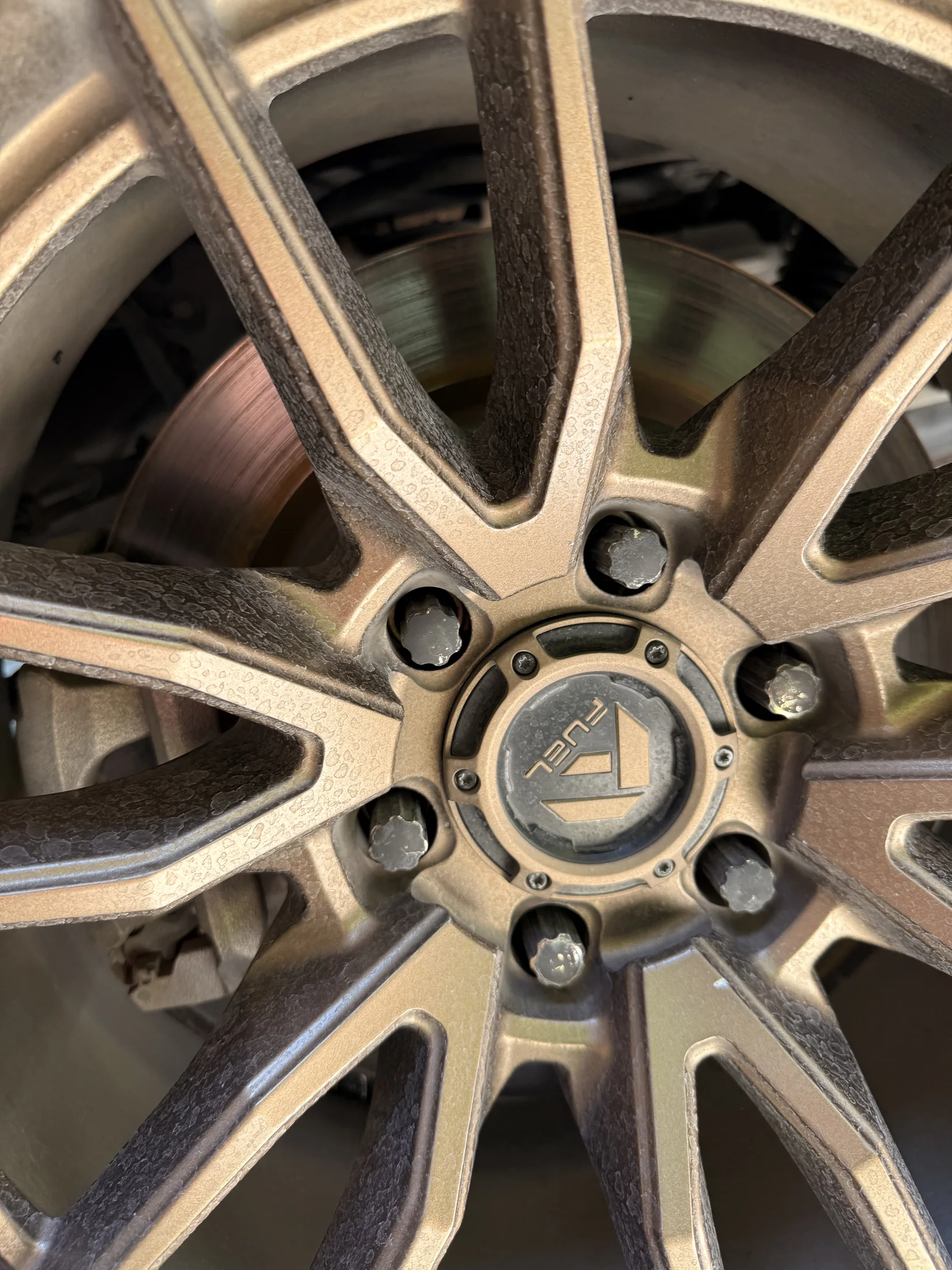 Wheel with water spots and buildup before exterior detailing